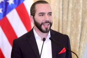 Nayib Bukele speaks in front of an American flag at the US Embassy in El Salvador