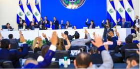 Legislative Assembly members raise hands voting in favor of constitutional amendment