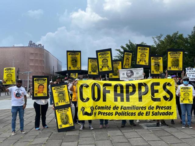 COFAPPES members, dressed in yellow, hold signs at a protest on September 15, 2024