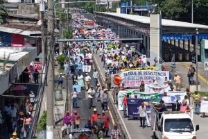 Thousands march in opposition to Bukele regime on Salvadoran Independence Day.